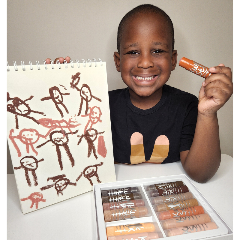 child drawing with kwik stix global skin tones