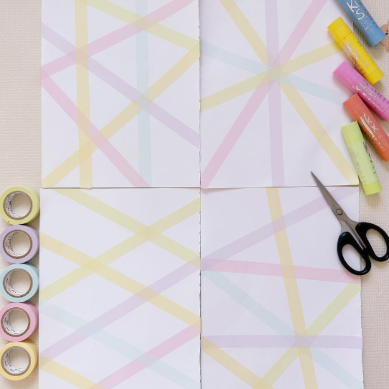 washi tape on paper with Kwik Stix on a table