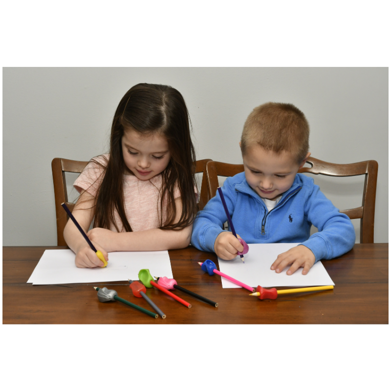 children using pencil grippers for handwriting help